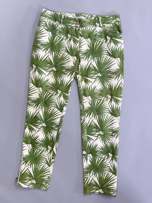 Vintage 2000s Celine Palm Leaf Print Skinny Jeans: Vintage 2000s Celine Palm Leaf Print Skinny Jeans having two front and two back pockets with zip front closure and zips at leg cuffs. Labeled Celine - marked size 42. Measuring 32 inch waist, 10 inch 