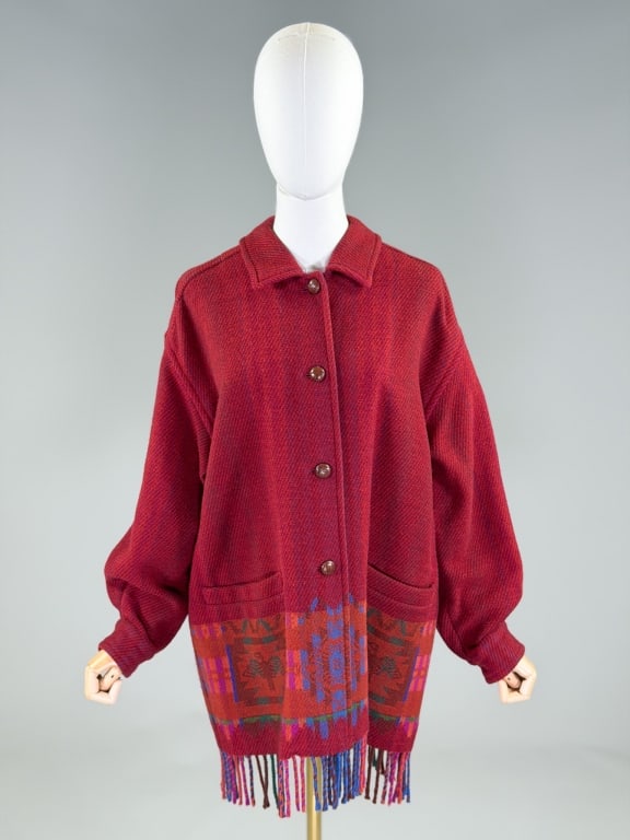 Vintage 2000s Bogner Wool Blanket Coat Jacket: Vintage 2000s Bogner Wool Blanket Coat Jacket having button front closure with two front pockets and fringe hem. Labeled Bogner Made in Germany. Measuring 46 inch chest, 33 inches long, 21 inch