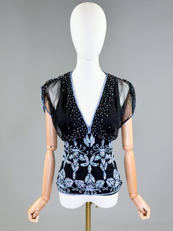 Vintage 2000s Sequin Beaded Net Mesh Top Blouse: Vintage 2000s Sequin Beaded Net Mesh Top Blouse having beaded sequin details throughout with deep v-neckline and side zip closure. Measuring 32-42 inch bust, 28-32 inch waist, 23 inches long. From