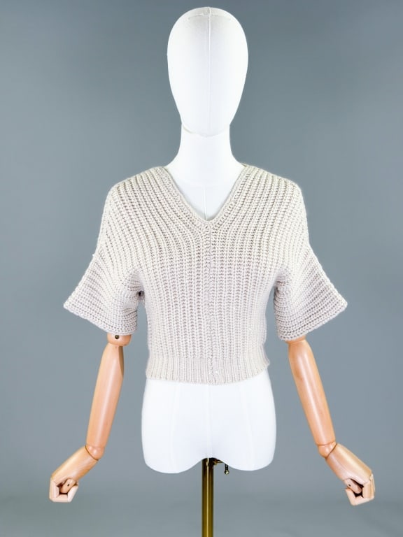 Vintage Cashmere Sequin Knit Cropped Sweater Top: Vintage Cashmere Sequin Knit Cropped Sweater Top having v-neckline with short sleeves and stretch throughout. Marked size US M - 100% Cashmere Made in Italy. Measuring 34 - 44 inch bust, 17 inches lon