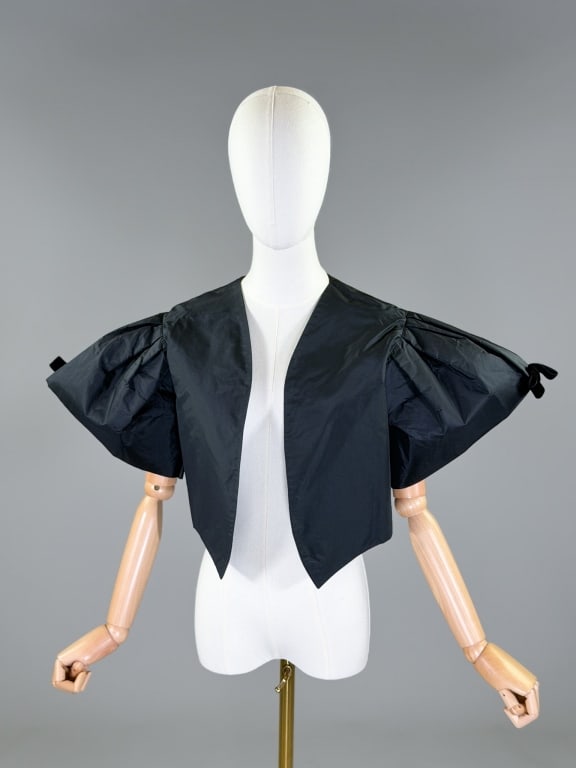 Vintage Lily Horesh Silk Taffeta Bolero Jacket: Vintage Lily Horesh Silk Taffeta Bolero Jacket having cropped style with open front and exaggerated puffed sleeves with bow details. Labeled Designed by Lily Horesh Baltimore. Measuring 18 inches long