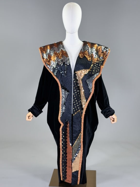 Vintage Black Velvet Sequin Embellished Coat: Vintage Black Velvet Sequin Embellished Coat having embellished shawl collar neckline and open front with velvet body and pockets at sides, unlined throughout. Measuring one size fits most, 48 inches