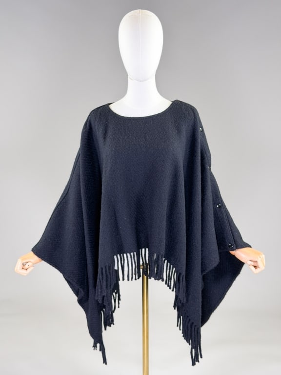 Vintage Jean-Charles de Castelbajac Wool Cape: Vintage Jean-Charles de Castelbajac Wool Fringe Cape Coat Wrap having snaps down shoulder seams with fringed edges. Labeled J.C. de Castelbajac. One size fits most, measuring approximately 27 inches l