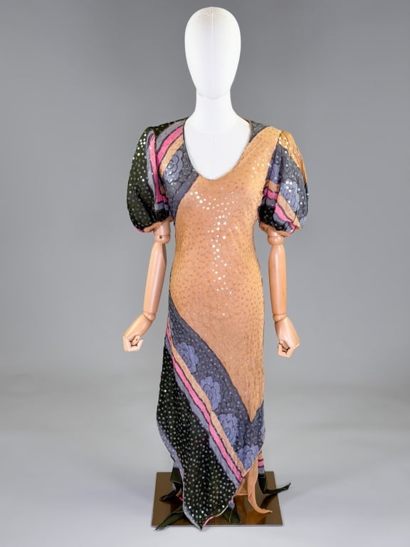 Vintage Judy Hornby Couture Silk Sequin Gown Dress: Vintage Judy Hornby Couture Silk Sequin Gown Dress having v-neckline with short puffed sleeves, bias cut throughout, fully lined. Labeled Judy Hornby Couture. Measuring 32 - 42 inch bust, 24 - 42 inch