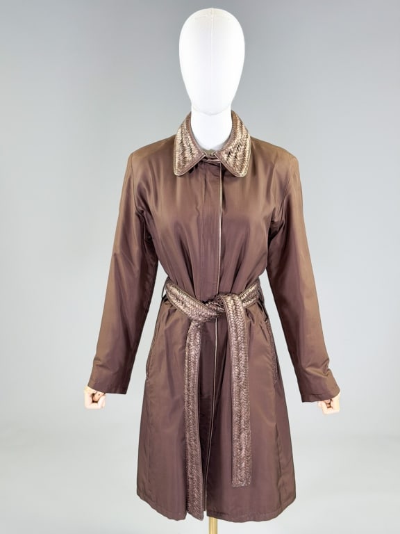 Vintage Nylon Rain Trench Coat Leather Trim Jacket: Vintage Nylon Rain Trench Coat Leather Trim Jacket having woven leather trim details with zip front closure, fully lined throughout. Measuring 38 inch bust, 36 inch waist, 38 inches long, 24 inch slee