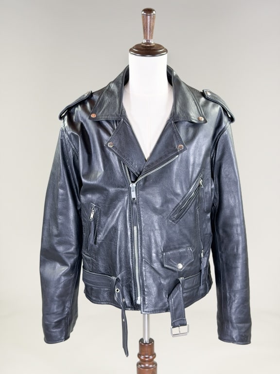 Vintage Black Leather Motorcycle Jacket Coat: Vintage Black Leather Motorcycle Jacket Coat having classic motorcycle jacket details throughout. Measuring 54 inch chest, 46 inch waist, 26 inches long, 27 inch sleeve length. From the lifetime colle