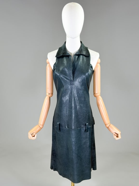 Jitrois Metallic Leather A-Line Drop Waist Dress: Jitrois Metallic Leather A-Line Drop Waist Dress having collar at neck with quarter placket opening and drop waist belt loops, closing at center back with zip. Labeled Jitrois, marked size 44. Measuri