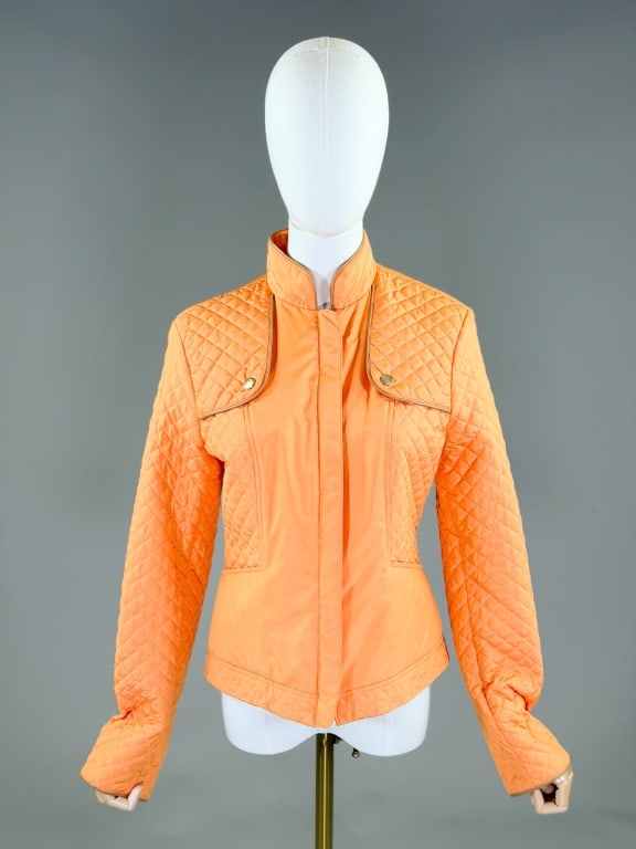 Les Copains Nylon Quilted Zip-Front Jacket: Les Copains Nylon Quilted Zip-Front Jacket having mandarin collar and two way zip front closure. Labeled Les Copains, marked size 42. Measuring 36 inch bust, 32 inch waist, 22 inches long, 25 inch sle
