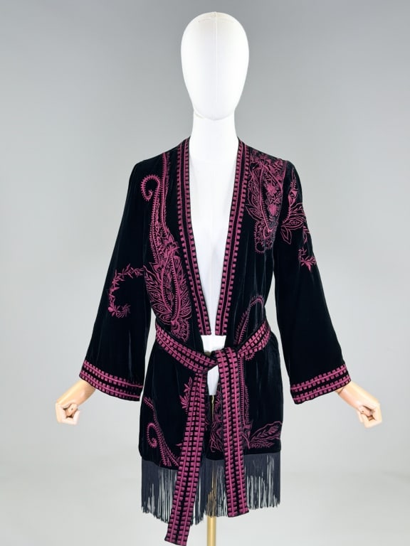 Kobi Halperin Embroidered Velvet Fringe Jacket: Kobi Halperin Embroidered Velvet Fringe Jacket having embroidery throughout with fringe hem and open front. Labeled Kobi Halperin, marked size XS/S. Measuring 35 inches long, 22 inch sleeve length.