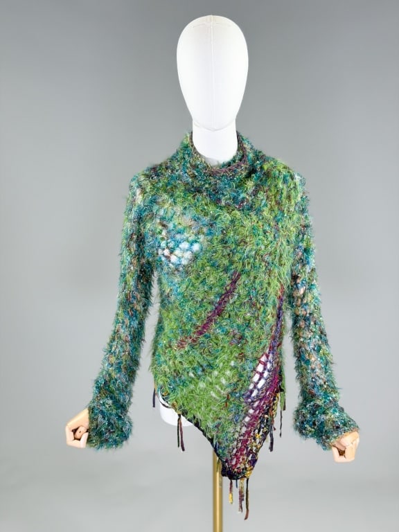 Vintage Handmade Crochet Fuzzy Art Sweater: Vintage Handmade Crochet Fuzzy Art Sweater having turtleneck with asymmetrical hem and elongated sleeves. Measuring 32-50 inch bust, 34 inches long, 33 inch sleeve length. From the lifetime