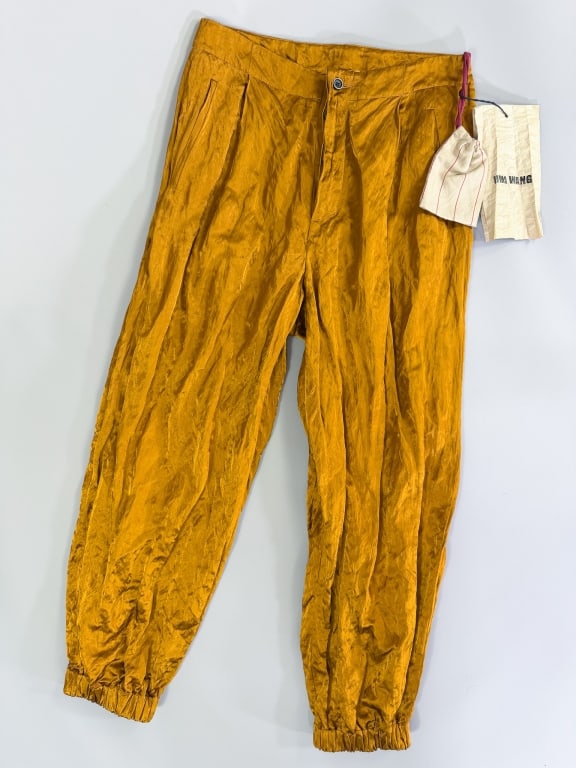 Uma Wang Pleated Crinkle Satin Trousers Pants: Uma Wang Pleated Crinkle Satin Trousers Pants having button front closure with two front and two back pockets. Labeled Uma Wang, marked size Medium. Original tags attached. Measuring 30 inch waist, 13