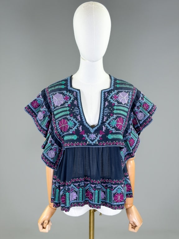 Isabel Marant Embroidered Cotton Folk Blouse Top: Isabel Marant Embroidered Cotton Folk Blouse Top having embroidery throughout. Labeled Isabel Marant, marked size 34. Measuring 32 inch bust, 24 inches long, 5 inch sleeve length. With original price
