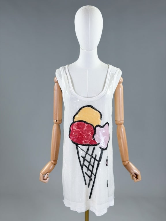 Vintage 2000s Fiorucci Sequin Ice Cream Knit Dress: Vintage 2000s Oscar de la Renta Pleated Dress having stretch throughout with sequin front. Marked size 42. Measuring 34-44 inch bust, 33 inches long. From the lifetime collection, fashion archive and 