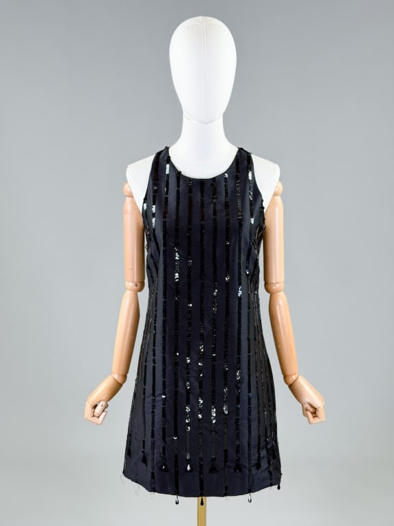 Vintage 2000s Moschino A Line Silk Sequin Dress: Vintage 2000s Moschino A Line Silk Sequin Dress having back zip closure and side pockets. Marked size US 6. Measuring 34 inch bust, 32 inch waist, 33.5 inches long. From the lifetime collection, fashi