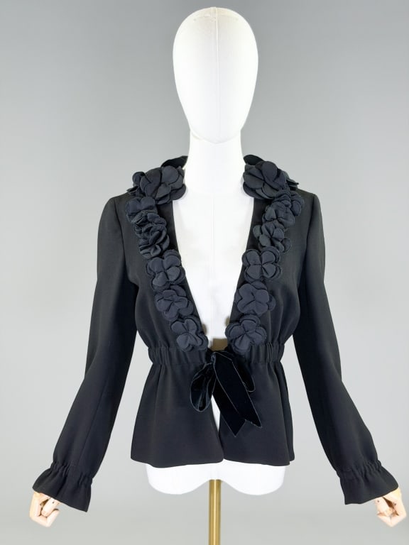 Vintage 2000s Moschino Floral Applique Jacket: Vintage 2000s Moschino Floral Applique Jacket having elastic waist with tie. Measuring 38 inch bust, 30-38 inch waist, 22 inches long, 24 inch sleeve length. From the lifetime collection, fashion