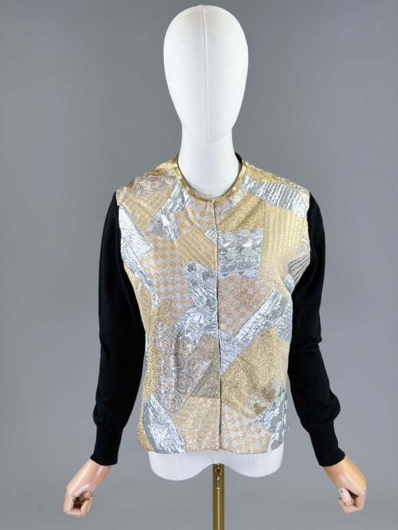 Vintage Metallic Patchwork Knit Cardigan Sweater: Vintage Metallic Patchwork Knit Cardigan Sweater having hook front closure. Measuring 40 inch bust, 22 inches long, 23 inch sleeve length. From the lifetime collection, fashion archive and business