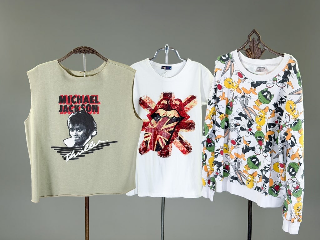 Collection of 3 Graphic T Shirts Sweatshirts Tops: Collection of 3 Graphic T Shirts Sweatshirts Tops having 1 Michael Jackson sweatshirt top measuring 44 inch chest, 23 inches long. 1 Rolling Stone Tongue Print Shirt measuring 34 inch chest, 26 inches