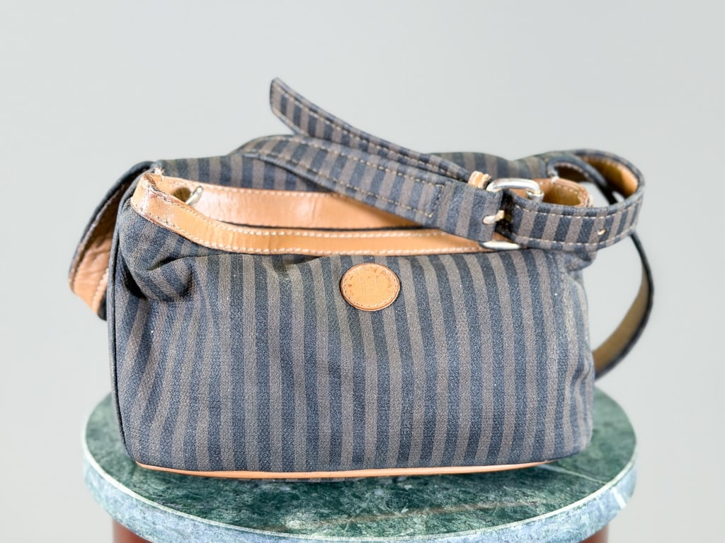 Vintage Fendi Canvas Stripe Crossbody Bag: Vintage Fendi Canvas Stripe Crossbody Bag having zip top closure. Measuring approximately 6 inches high by 9 inches wide by 4.5 inches deep. General wear as shown throughout. From the lifetime collect