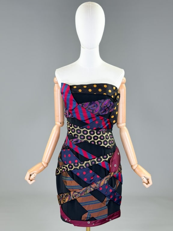 Vintage 1980s Moschino Silk Tie Strapless Dress: Vintage 1980s Moschino Silk Tie Strapless Dress having silk tie applique throughout with side zip closure. Labeled Moschino Couture. Marked size US 8. Measuring 34 inch bust, 26 inch waist, 30 inches 