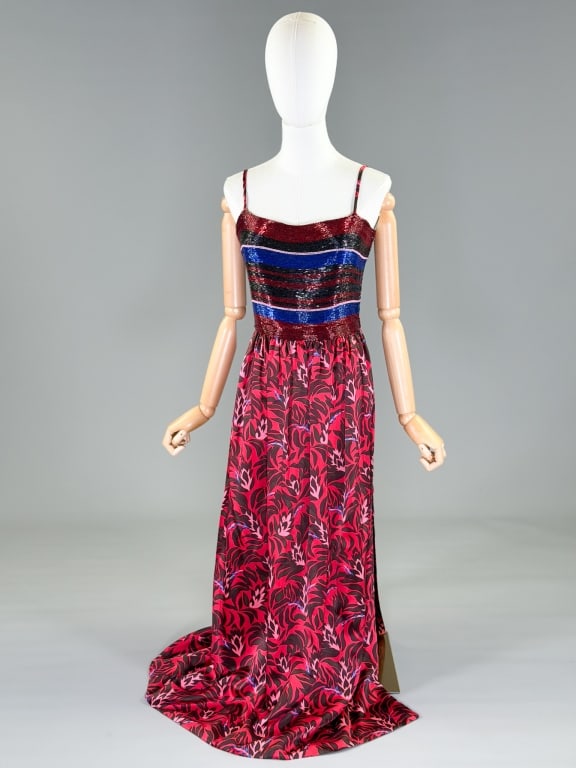 Vintage 1970s Galanos Beaded Silk Floral Gown: Vintage 1970s Galanos Beaded Silk Floral Gown having dense glass beading at bust with floral skirt and side zip closure. Measuring 34 inch bust, 26 inch waist, 55 inches long. From the lifetime collec