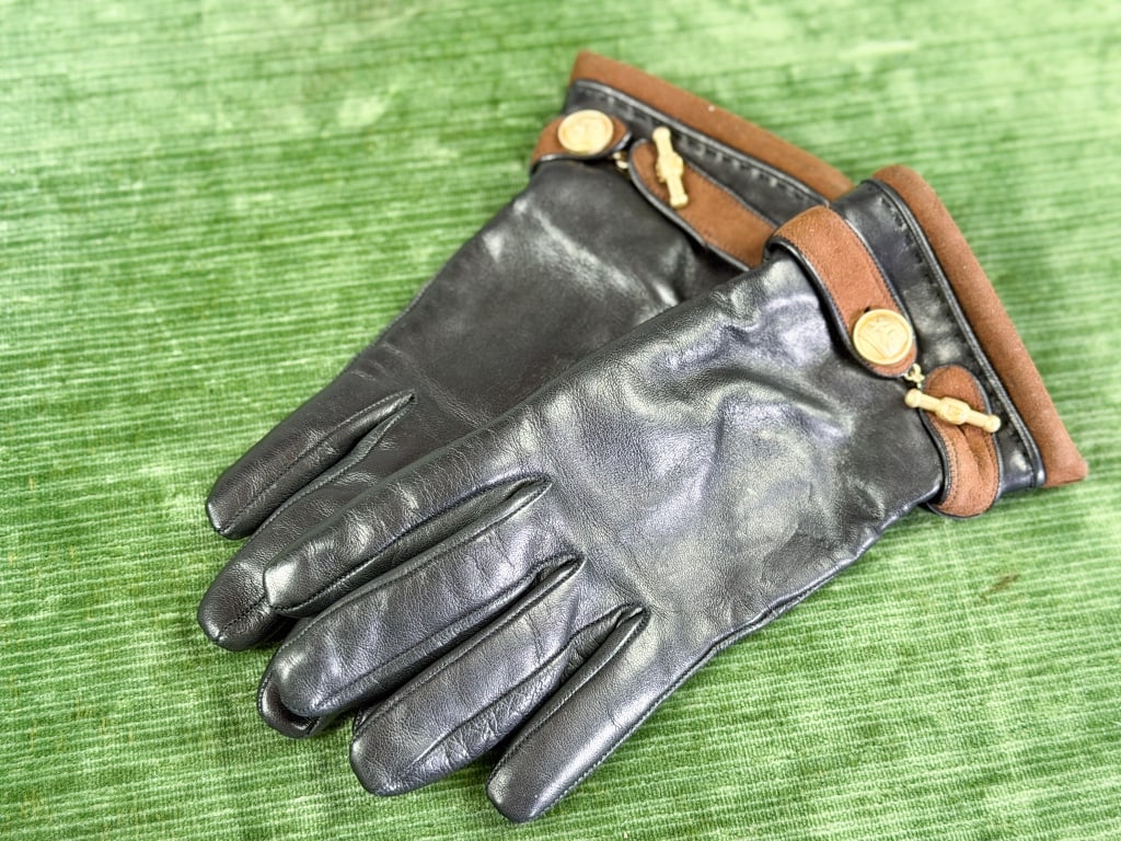 Vintage Barry Kieselstein-Cord Leather Gloves: Vintage Barry Kieselstein-Cord Leather Cashmere Hand Gloves having metal button and toggle details at wrists, cashmere knit lined, marked size 7. Measuring approximately 9 inches long. From the lifeti