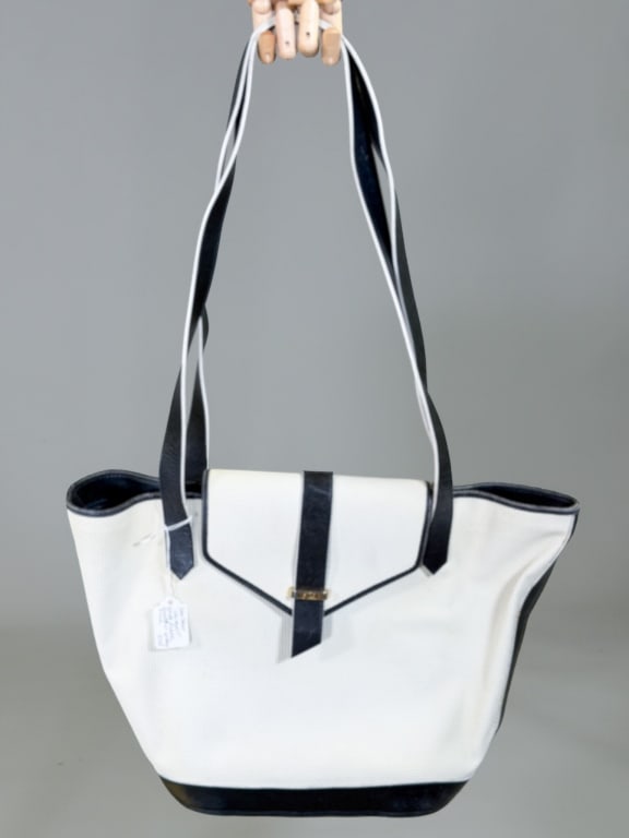 Vintage 1980s Yves Saint Laurent Vinyl Tote Bag: Vintage 1980s Yves Saint Laurent Vinyl Tote Bag Purse having magnetic snap front closure with zippered top and shoulder straps. Measuring approximately 11 inches high by 11 inches wide by 5 inches dee