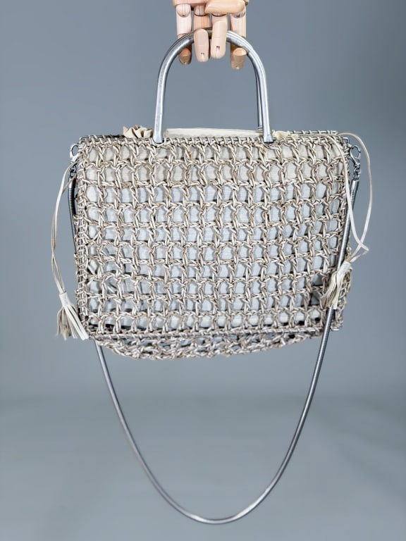 Vintage Salvatore Ferragamo Woven Leather Purse: Vintage Salvatore Ferragamo Woven Leather Purse Bag having drawstring top closure with metal handles and crossbody strap. Measuring approximately 8.5 inches high by 11 inches wide by 4 inches deep. Fr