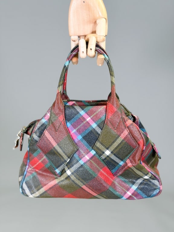 Vintage 1990s Vivienne Westwood Plaid Vinyl Bag: Vintage 1990s Vivienne Westwood Plaid Vinyl Bag Bowler Purse having zip top closure with top handles. Measuring approximately 8 inches high by 11 inches wide by 5 inches deep. From the lifetime collec