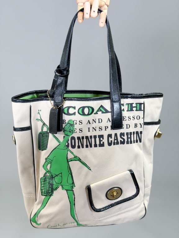 Vintage 2000s Coach Bonnie Cashin Tribute Tote Bag: Vintage 2000s Coach Bonnie Cashin Tribute Tote Bag having exterior pockets with metal lock closures and open top. Measuring approximately 13 inches high by 15 inches wide by 5 inches deep. General wea