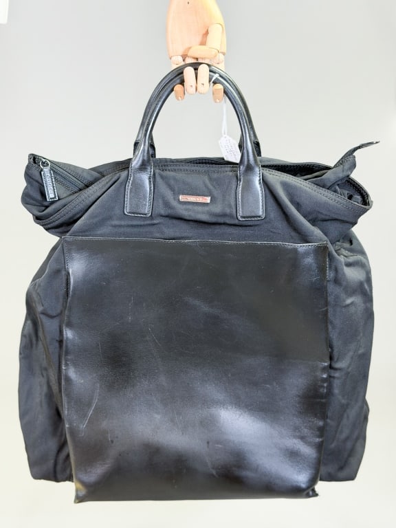 Vintage 1990s Gucci Nylon Leather Travel Tote Bag: Vintage 1990s Gucci Nylon Leather Travel Tote Bag having zippered top with front pocket and top handles. Measuring approximately 20 inches high by 22 inches wide by 7 inches deep. General wear as show