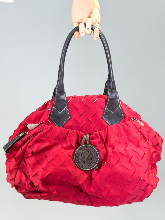 Vintage 1990s Vivienne Westwood Satin Tote Bag: Vintage 1990s Vivienne Westwood Satin Tote Bag having zip top closure with slashed details throughout and front pocket. Measuring approximately 12 inches by 19 inches by 8 inches. General wear as show