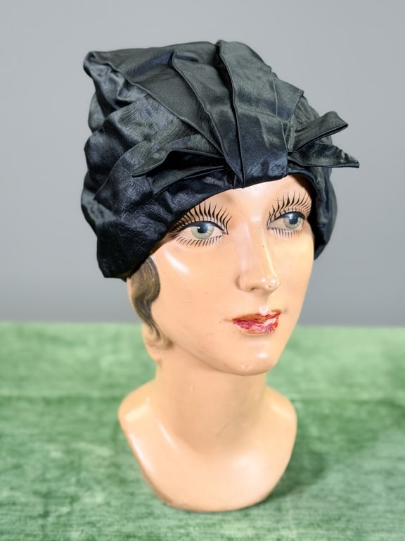 Vintage 1960s Christian Dior Satin Cloche Hat: Vintage 1960s Christian Dior Satin Cloche Hat. Interior circumference measuring approximately 21 inches. General wear as shown throughout. From the lifetime collection, fashion archive and business in