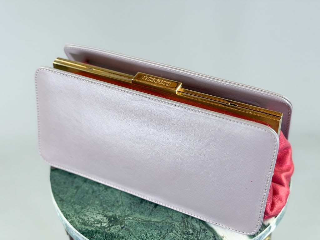 Vintage 2000s Missoni Metallic Leather Clutch Bag: Vintage 2000s Missoni Metallic Leather Clutch Bag having metal frame lock closure. Measuring approximately 6 inches high by 11 inches wide by 4 inches deep. From the lifetime collection, fashion archi