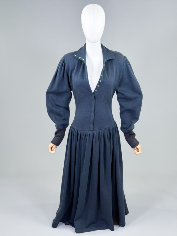 Vintage 1980s Norma Kamali Knit Sweatshirt Dress: Vintage 1980s Norma Kamali Knit Sweatshirt Dress having snap front closure with pleated skirt and stretch throughout. Measuring 34-36 inch bust, 26-30 inch waist, 49 inches long, 26 inch sleeve length