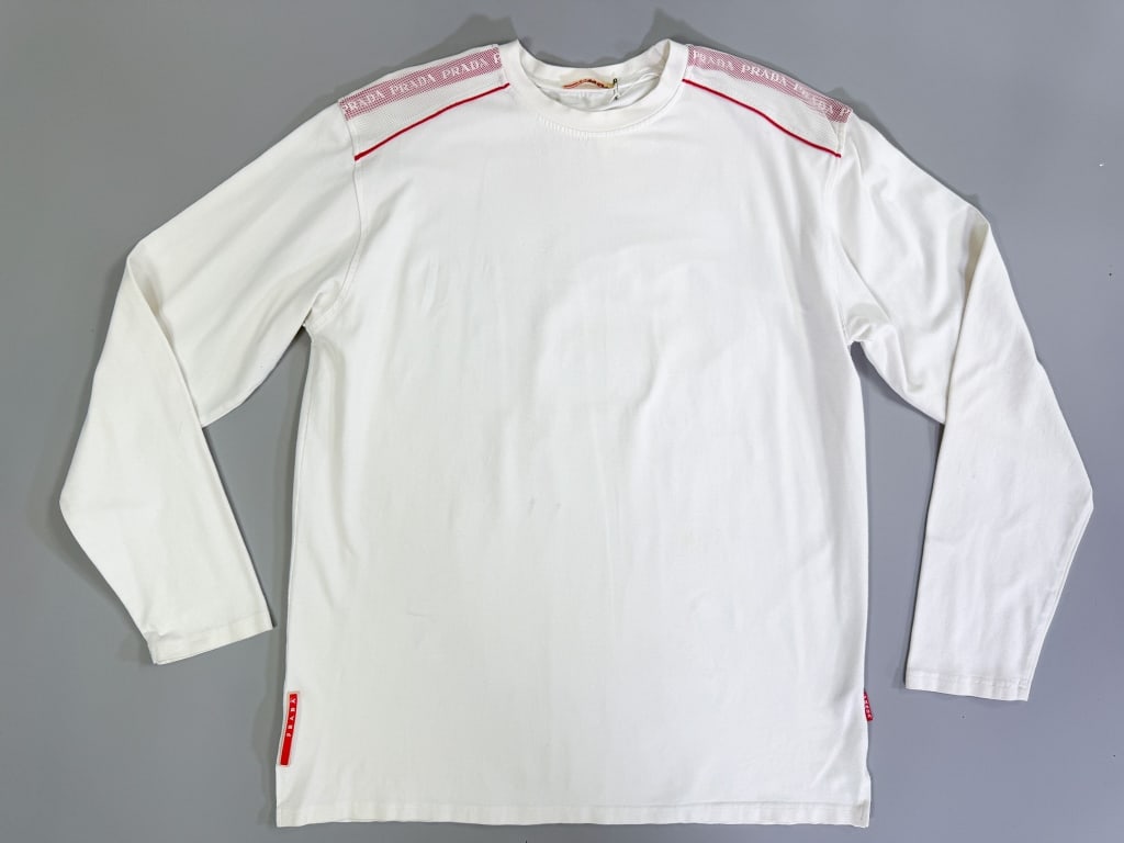 Vintage 1990s Prada Sport Cotton Knit Tee Shirt: Vintage 1990s Prada Sport Cotton Knit Tee Shirt having mesh detail at shoulders and stretch throughout. Marked size XL. Measuring 44 inch chest, 30 inches long, 25 inch sleeve length. General wear as 