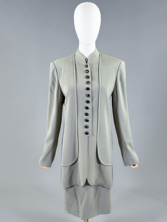 Vintage 1990s Emanuel Ungaro Wool 2 PC Skirt Suit: Vintage 1990s Emanuel Ungaro Wool 2 PC Skirt Suit having jacket with button front closure, measuring 40 inch bust, 36 inch waist, 32 inches long, 25 inch sleeve length and skirt with back zip closure 