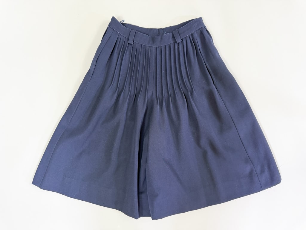 Vintage 1980s Valentino Wool Culottes Shorts: Vintage 1980s Valentino Wool Culottes Shorts having button front closure. Marked size 4. Measuring 25 inch waist, 13 inch rise, 11 inch inseam. General wear as shown throughout. From the lifetime coll