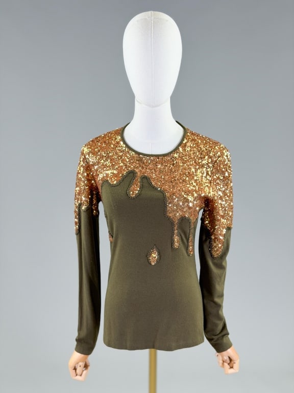 Vintage Moschino Sequin Knit Drip Tee Shirt Top: Vintage Moschino Sequin Knit Drip Tee Shirt Top having back neck zip closure and stretch throughout. Marked size US 4. Measuring 34-42 inch bust, 24 inches long, 24 inch sleeve length. From the lifeti