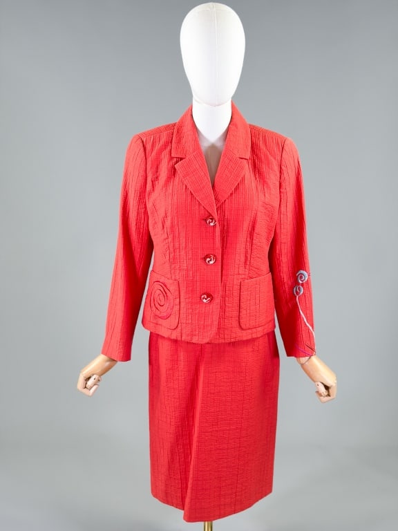Vintage 1990s Christian Lacroix Skirt Suit Set: Vintage 2000s Christian Lacroix Skirt Suit Set with jacket having button front closure and front pockets. Measuring 38 inch bust, 36 inch waist, 21 inches long, 21 inch sleeve length. Skirt with side 