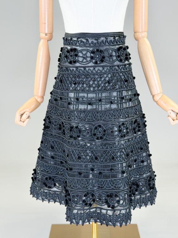 Vintage Naeem Khan Silk Embellished Skirt: Vintage Naeem Khan Silk Embellished Skirt having back zip closure. Marked size 12. Measuring 30 inch waist, 26 inches long, From the lifetime collection, fashion archive and business inventory of coll