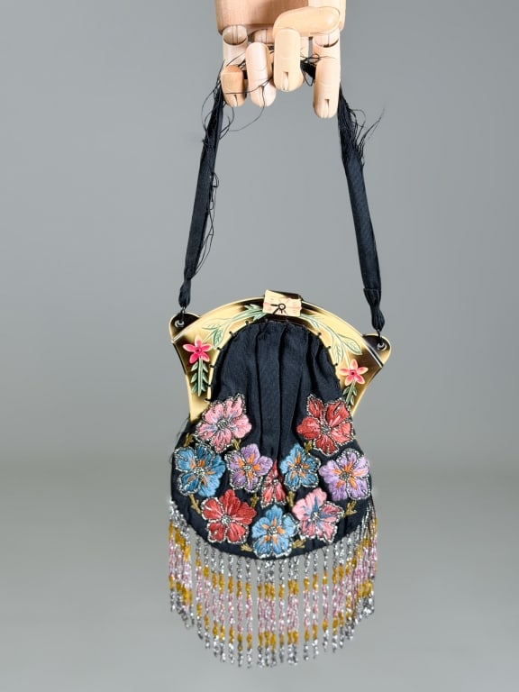 Antique 1920s Floral Fringe Evening Bag: Antique 1920s Floral Fringe Evening Bag having carved celluloid frame closure with floral embroidery and fringe throughout. Measuring approximately 7 inches high by 5 inches wide by 1 inch deep. Gener