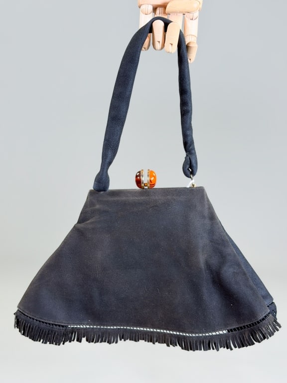 Vintage 1940s Suede Leather Fringe Bag: Vintage 1940s Suede Leather Fringe Bag having metal frame kiss lock closure. Measuring approximately 8 inches high by 13 inches wide. From the lifetime collection, fashion archive and business invento