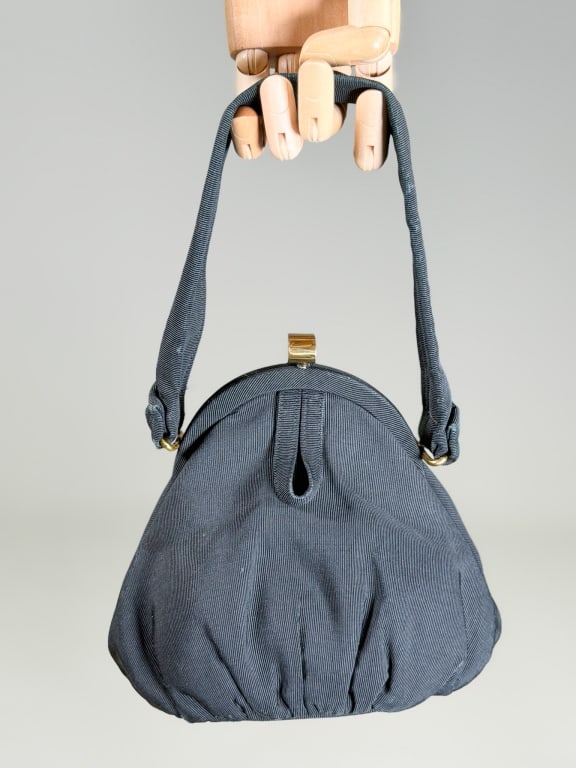 Vintage 1950s Silk Faille Evening Bag: Vintage 1950s Silk Faille Evening Bag having metal frame lock closure with top handle. Measuring approximately 6 inches high by 7 inches wide by 4.5 inches deep. From the lifetime collection, fashion 