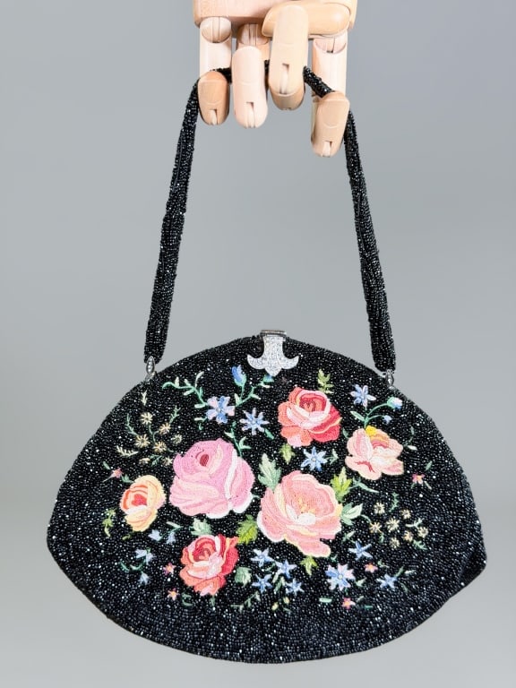 Vintage 1950s Beaded Floral Evening Bag: Vintage 1950s Beaded Floral Evening Bag having metal frame lock closure with rhinestone details. Measuring approximately 6 inches high by 9 inches wide by 2 inches deep. From the lifetime collection, 