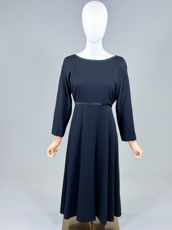 Vintage 1960s Mollie Parnis Wool Wrap Dress: Vintage 1960s Mollie Parnis Wool Wrap Dress having wrap closure, knit throughout with stretch. Measuring 38-46 inch bust, 28-32 inch waist, 44 inches long, 20 inch sleeve length. From the lifetime col