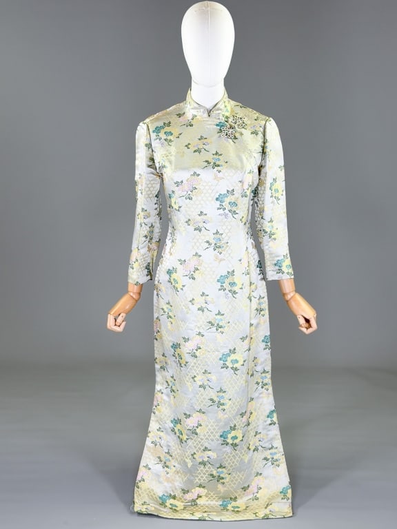 Vintage 1960s Floral Brocade Qipao Dress: Vintage 1960s Floral Brocade Qipao Dress having side zip closure and frog closure at neck. Marked size 10. Measuring 36 inch bust, 30 inch waist, 52 inches long, 19 inch sleeve length. From the lifeti