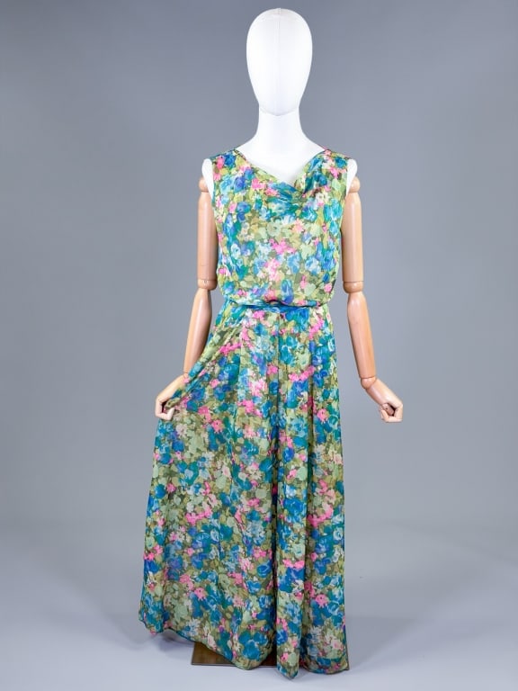 Vintage 1970s Floral Printed Chiffon Jumpsuit: Vintage 1970s Floral Printed Chiffon Jumpsuit having cowl neckline with back zip closure and belt at waist. Measuring 34-40 inch bust, 30-32 inch waist, 53 inches long. General wear throughout as show