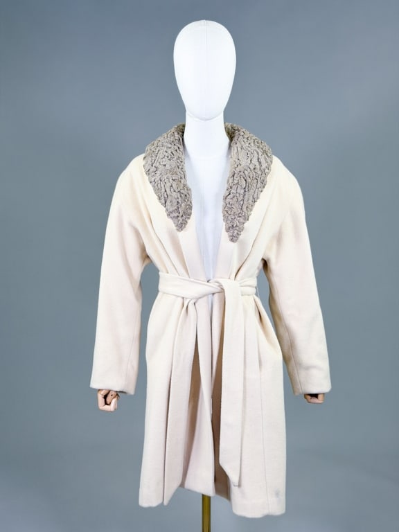 1970s Cashmere Blonde Astrakhan Lamb Fur Coat: Vintage 1970s Cashmere & Curly Blonde Astrakhan Lamb Fur Swing Coat having open front with belt at waist. Measuring 38 inches long, 23 inch sleeve length. From the lifetime collection, fashion archive
