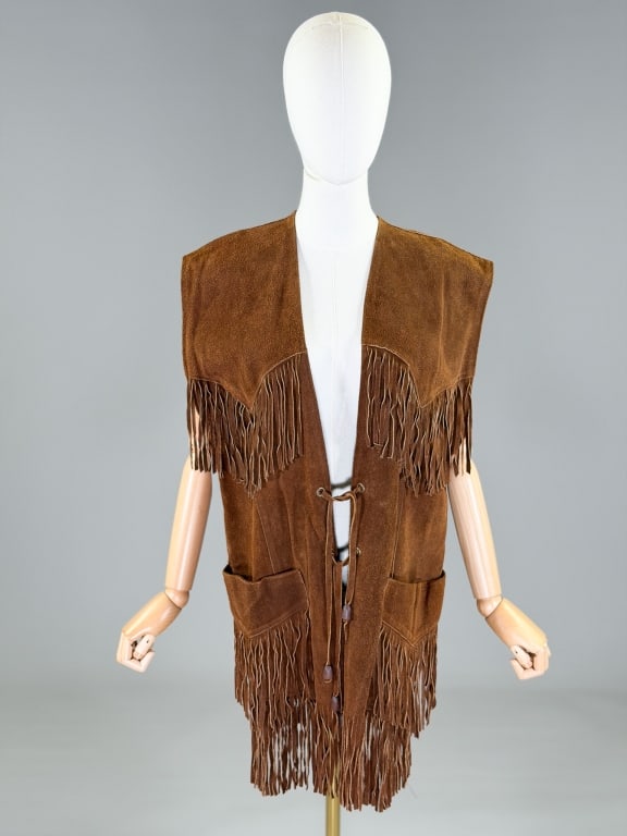 Vintage 1970s Fringe Suede Western Vest Top: Vintage 1970s Fringe Suede Western Vest Top having tie closure at front. Marked size Large. Measuring 35 inches long. From the lifetime collection, fashion archive and business inventory of collector 