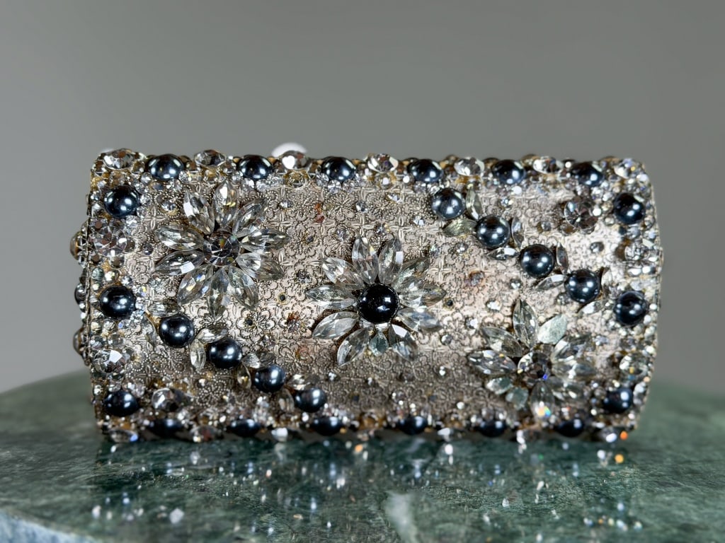 Vintage 1960s Metal Rhinestone Clutch Bag: Vintage 1960s Metal Rhinestone Clutch Bag having lock closure at top with rhinestone and pearl details throughout. Labeled Coblentz - Made in Italy. Measuring approximately 3.5 inches high by 6.5 inch
